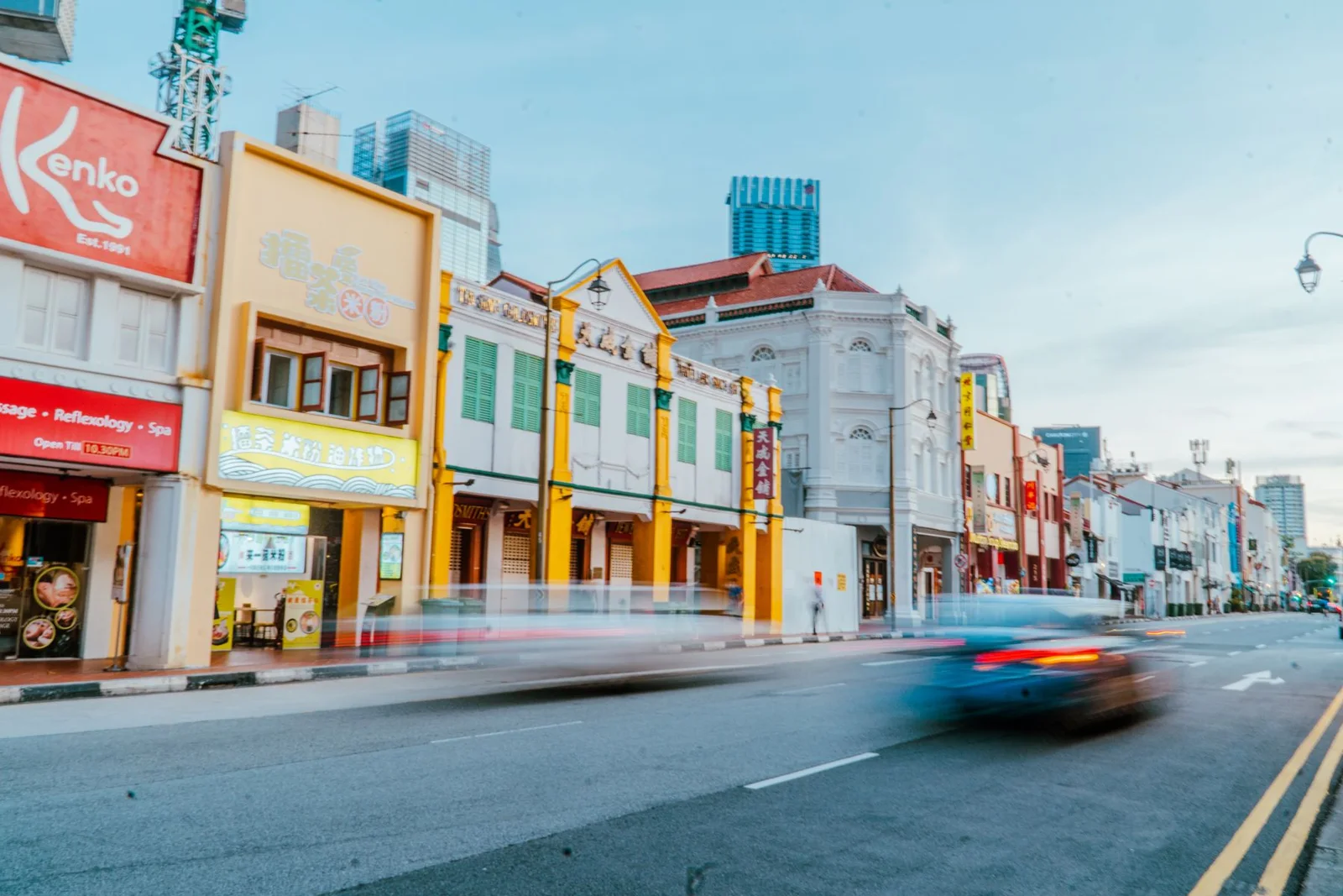 Traffic moving past Singapore’s historic shophouses
